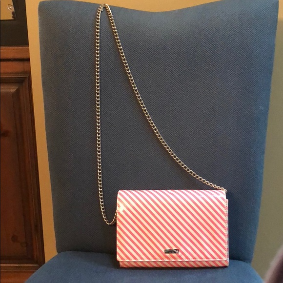 kate spade Handbags - Pink striped patent bag with gold trimming.